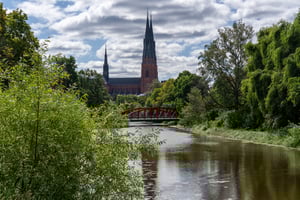 scenic-view-of-uppsala-cathedral-with-a-red-bridge-2024-10-15-21-55-57-utc